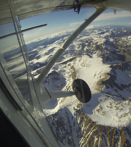 The view from a Twin Otter aircraft carrying NASA's Airborne Snow Observatory on April 3, 2013, as it flies over Mt. Dana and Dana Plateau in the Tuolumne River Basin within Yosemite National Park, Calif. (Credit: NASA/JPL-Caltech)