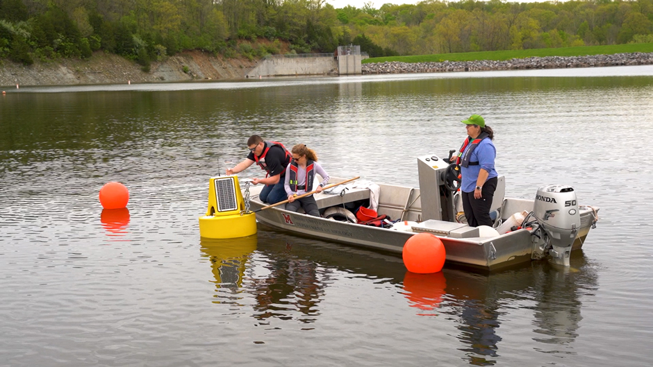 NexSens Applications Scientist Joe Davidson assisting the Miami University team with the deployment of the XB-200 data buoy.