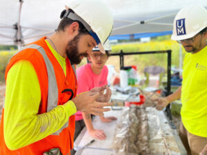 Rodrigo Villalpando-Vizcaino student Jefferson Minton (center) and staff Saddam Hossain (right). Describing and sampling sediment samples extracted with sonic drilling.