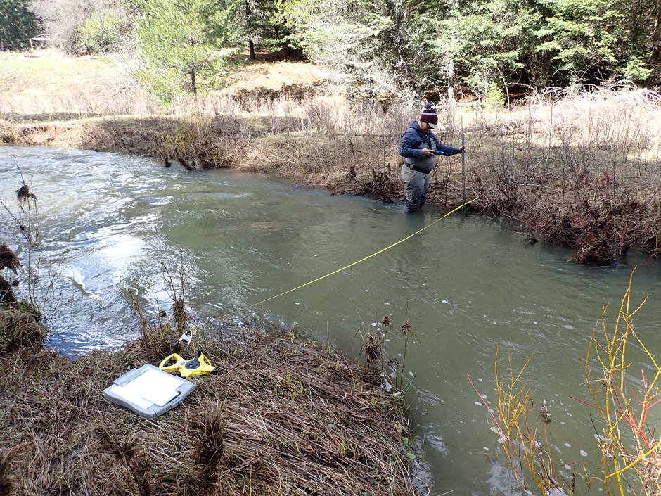 Sara Anzalone of the Idaho DEQ collecting flow measurements in an upper Clearwater River tributary.