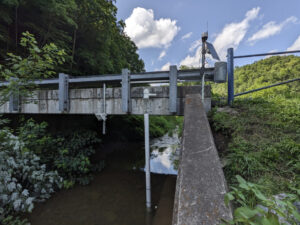 Cowan Creek monitoring site, equipped with Geolux non-contact flow sensor and EXO2 sonde, telemetered via NexSens X3. The site is located at the Cowan Elementary School. Educators use the data to monitor conditions in the stream via the WQDataLive public portal and teach components of the water cycle.