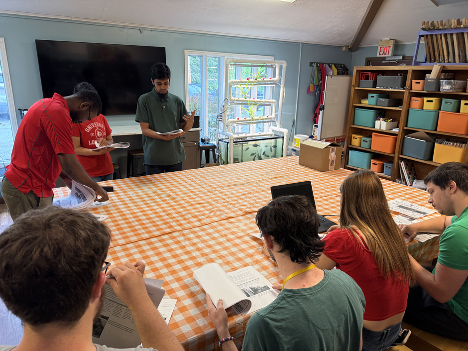 Franklin Kondum, Ridwan Nur, and Anju Thapa, graduate students at UofL, demonstrate to youth community members in Letcher County how to use and collect data from Solinst Levelogger 5 LTC sensors.