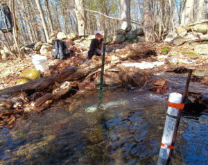 Instrumentation at one of the 1st-order tributary sites (Saddleback Mountain) within the Lamprey River watershed. On river right is a PVC pipe housing a S::CAN spectrolyser. In the foreground, a HOBO pressure transducer and staff gauge are housed in PVC.