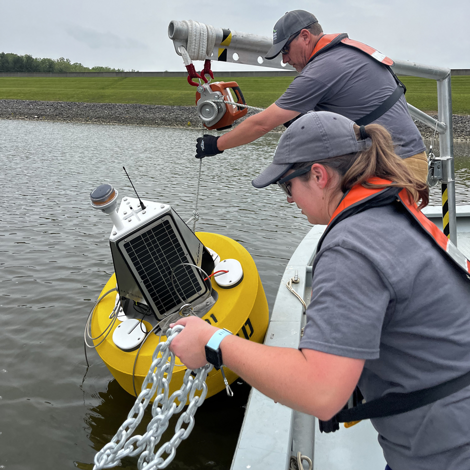 Matt Thomas and Bailey Miller deploying data buoy CM-01 from RV Beaver and Charles Mill Lake.