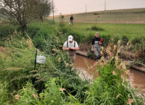 Jacob Winters and Sara Richard mapping logger placement in Turtle Creek.