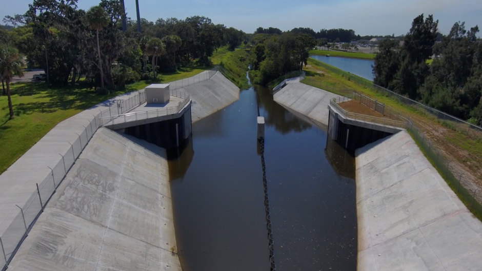 The M-1 Canal and operable weir (submerged in the photo), which prevents water from flowing into the Indian River Lagoon.