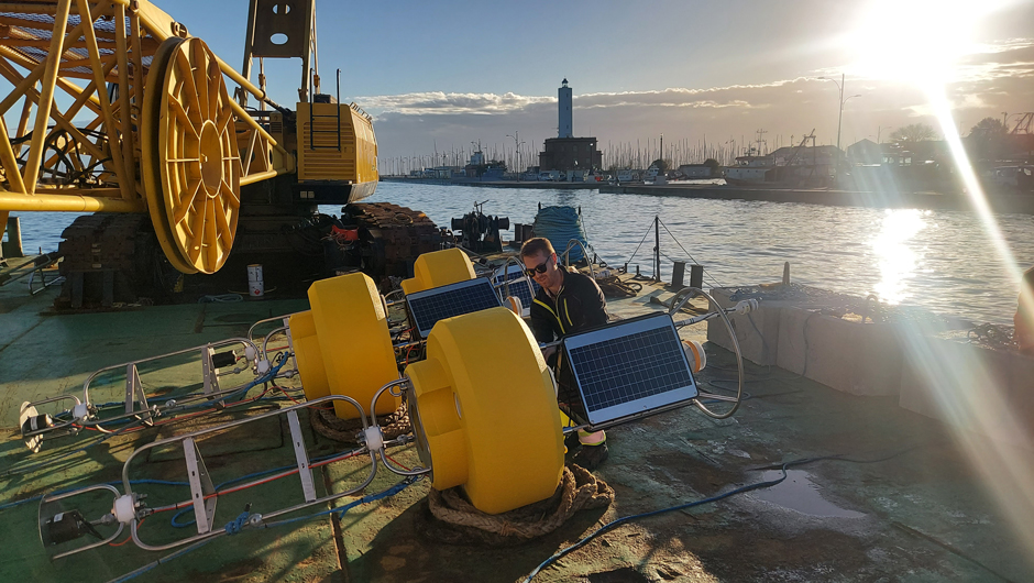 The buoys receive their final preparations as they travel to sea for deployment. (Credit: Mike Voellmecke)