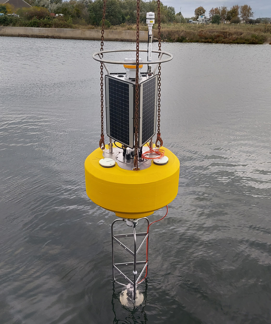 A final in-water test to confirm operation of the Doppler current profiler is performed. (Credit: Mike Voellmecke)