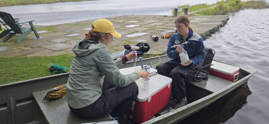 Current graduate students Georgia Larzelere and Shaelyn Prada using the headspace technique to measure dissolved greenhouse gases in water from Lake Lacawac.