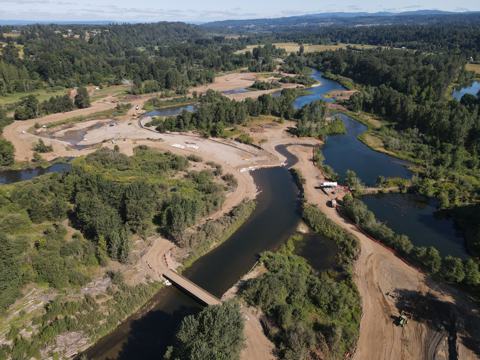 A temporary diversion dam was built to relocate the flow of the East Fork Lewis River during the summer of 2025 so construction crews could reclaim the gravel pits and restore the river.